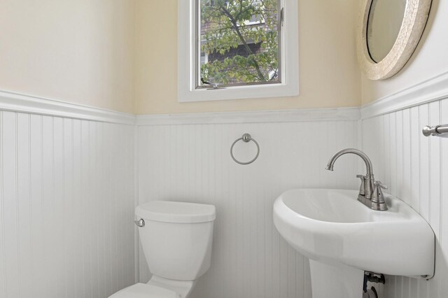 57 Maple Ave, Bay Shore, NY 11706 - bathroom with wainscoting, toilet, and a sink