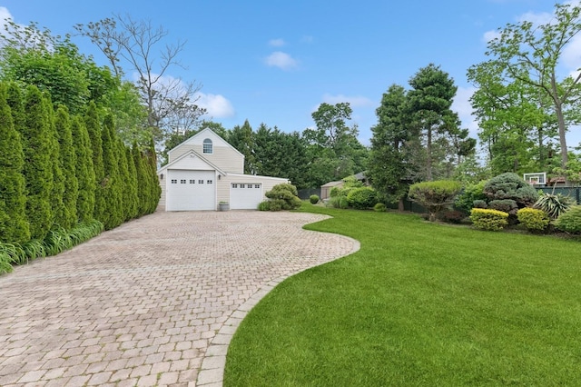 57 Maple Ave, Bay Shore, NY 11706 - view of grassy yard with a garage and driveway