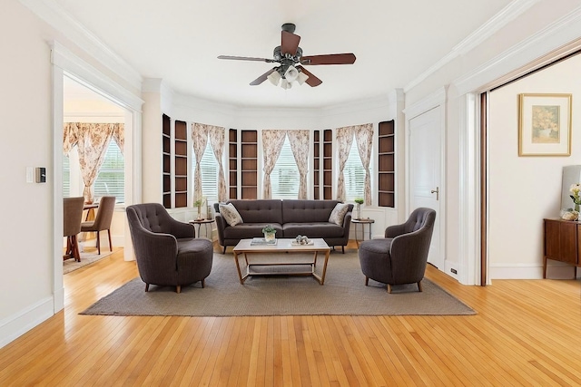 57 Maple Ave, Bay Shore, NY 11706 - living area with a ceiling fan, hardwood / wood-style floors, baseboards, ornamental molding, and built in features
