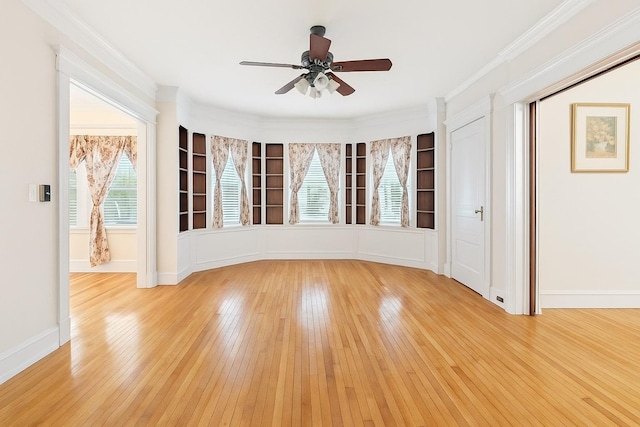 57 Maple Ave, Bay Shore, NY 11706 - spare room with light wood-type flooring, ceiling fan, baseboards, and crown molding