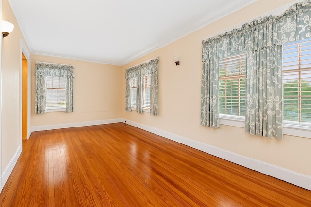 57 Maple Ave, Bay Shore, NY 11706 - unfurnished room with baseboards, ornamental molding, and wood finished floors