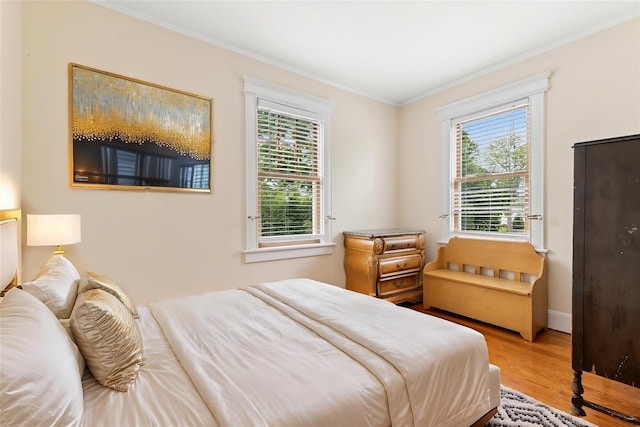 57 Maple Ave, Bay Shore, NY 11706 - bedroom with wood finished floors, ornamental molding, and baseboards