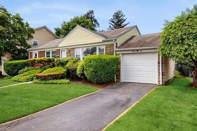 29 Melanie Ln, Syosset, NY 11791 - view of front of property featuring driveway, a garage, and a front lawn