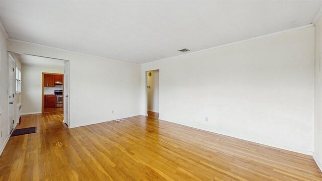 29 Melanie Ln, Syosset, NY 11791 - spare room featuring light wood-style floors and baseboards