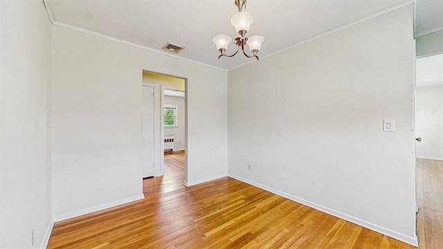 29 Melanie Ln, Syosset, NY 11791 - spare room featuring light wood-style flooring, crown molding, a chandelier, baseboards, and radiator heating unit