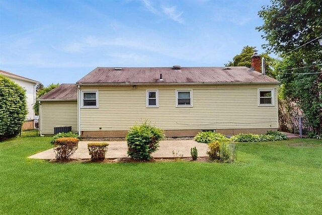 29 Melanie Ln, Syosset, NY 11791 - rear view of house with a lawn and a chimney