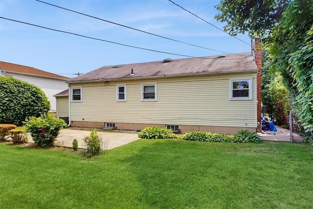 29 Melanie Ln, Syosset, NY 11791 - rear view of house featuring a patio, a lawn, and a chimney