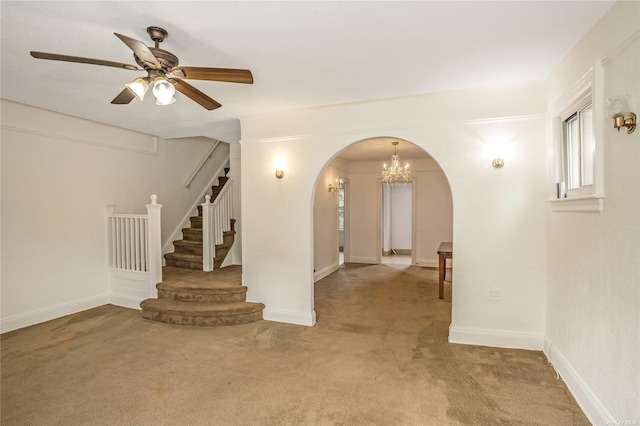 53-42 63rd St, Maspeth, NY 11378 - empty room featuring arched walkways, stairway, light carpet, a chandelier, and ceiling fan