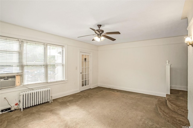 53-42 63rd St, Maspeth, NY 11378 - carpeted empty room with radiator heating unit, ceiling fan, and baseboards
