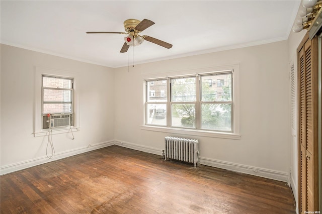 53-42 63rd St, Maspeth, NY 11378 - unfurnished bedroom featuring radiator, multiple windows, cooling unit, dark wood-type flooring, and ornamental molding