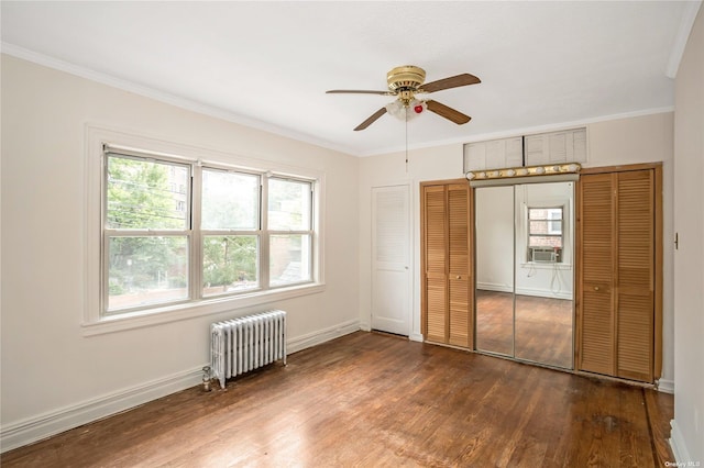 53-42 63rd St, Maspeth, NY 11378 - unfurnished bedroom with radiator, wood finished floors, multiple windows, ornamental molding, and cooling unit