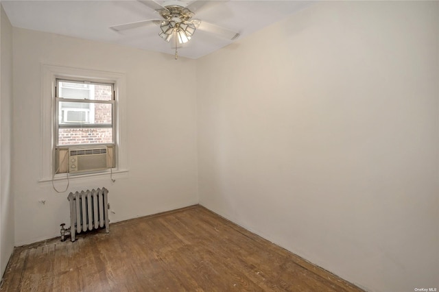 53-42 63rd St, Maspeth, NY 11378 - unfurnished room featuring radiator, wood finished floors, cooling unit, and ceiling fan