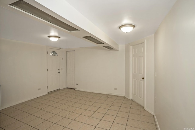 53-42 63rd St, Maspeth, NY 11378 - unfurnished room featuring baseboards and light tile patterned floors