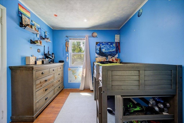 287 Norton Rd, Red Hook, NY 12571 - bedroom featuring ornamental molding, light wood-style flooring, and a textured ceiling