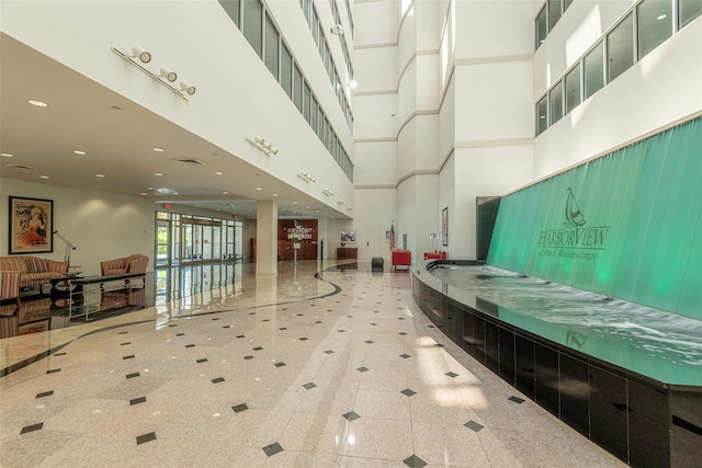 100 Harbor View Dr Unit 607, Port Washington, NY 11050 - common area featuring a high ceiling and recessed lighting