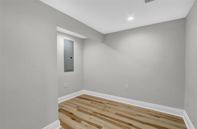 2614 Milburn Ave, Baldwin, NY 11510 - unfurnished room with electric panel, baseboards, wood finished floors, and recessed lighting