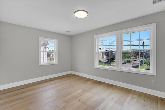 2614 Milburn Ave, Baldwin, NY 11510 - unfurnished room with plenty of natural light, baseboards, and light wood-style flooring