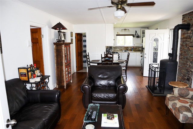 240 Cooks Brook Rd, Roscoe, NY 12776 - living room with a wood stove, a ceiling fan, and dark wood-style flooring