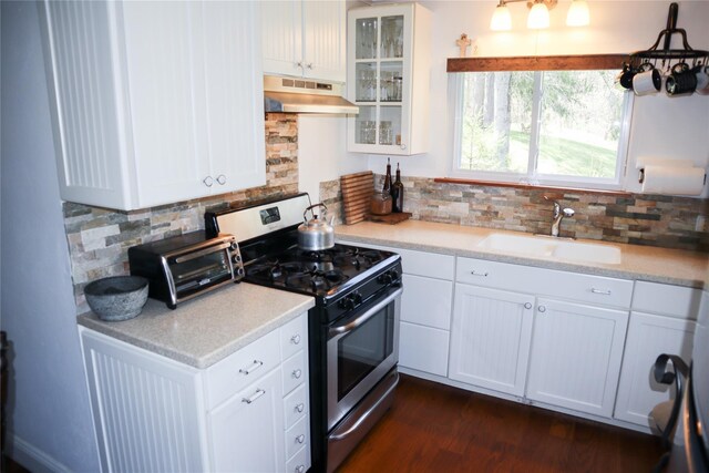 240 Cooks Brook Rd, Roscoe, NY 12776 - kitchen featuring stainless steel gas range oven, under cabinet range hood, tasteful backsplash, and white cabinets
