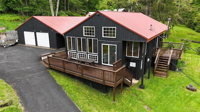 240 Cooks Brook Rd, Roscoe, NY 12776 - back of property featuring a deck, a metal roof, stairway, and a lawn