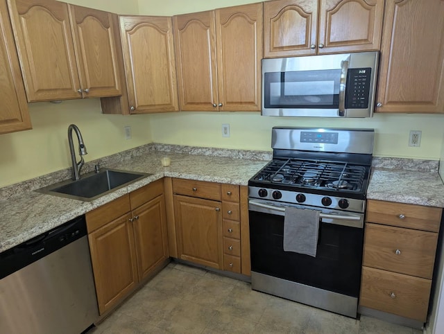 325 King St Unit 6J, Port Chester, NY 10573 - kitchen featuring appliances with stainless steel finishes and light stone counters
