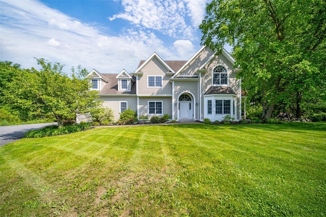 2 Marion Way, Lagrangeville, NY 12540 - view of front of home with a front yard and a chimney