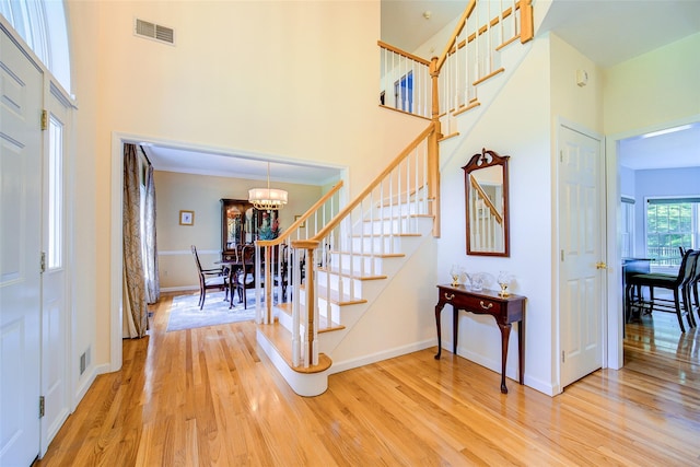 2 Marion Way, Lagrangeville, NY 12540 - foyer entrance with stairway, light wood-style floors, a chandelier, and a high ceiling
