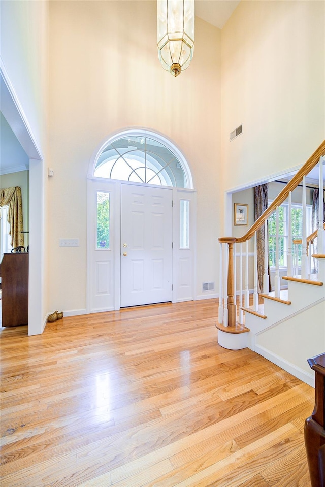 2 Marion Way, Lagrangeville, NY 12540 - entrance foyer with a high ceiling, wood finished floors, and stairs