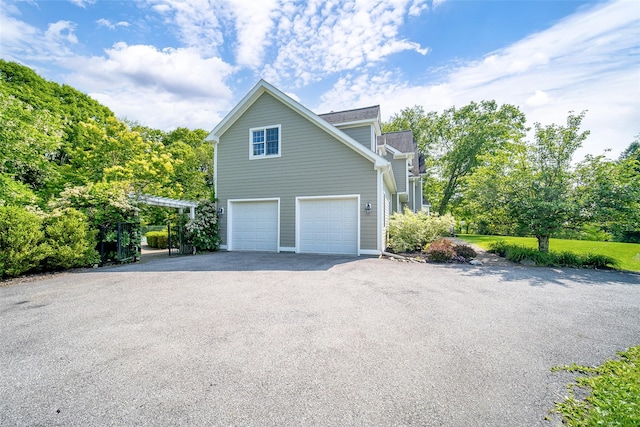2 Marion Way, Lagrangeville, NY 12540 - view of side of home featuring driveway and a garage