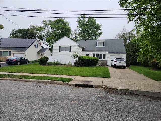 1055 Melissa Ln, North Bellmore, NY 11710 - view of front of house featuring an attached garage, a front yard, and driveway