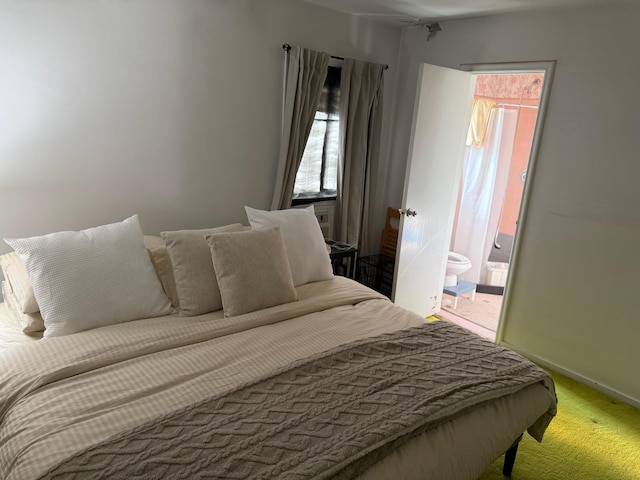 1055 Melissa Ln, North Bellmore, NY 11710 - bedroom with carpet floors, baseboards, multiple windows, and ensuite bath
