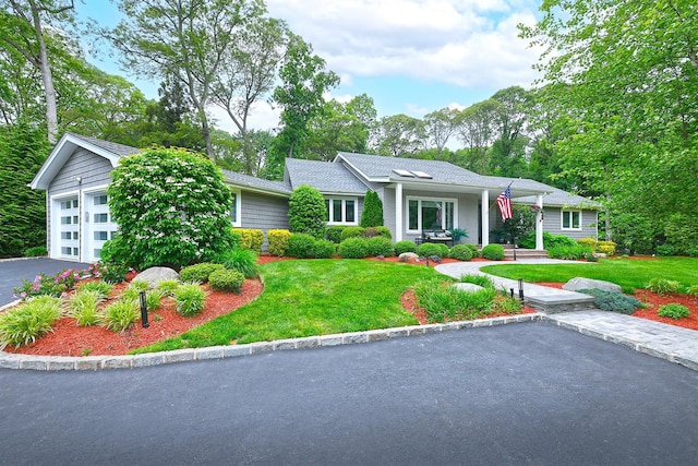 47 Wilmington Dr, Melville, NY 11747 - ranch-style house with a garage, a front lawn, and driveway