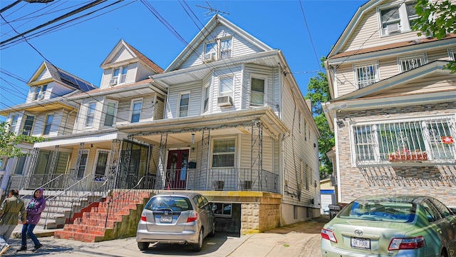 5214 92nd St, Elmhurst, NY 11373 - view of front of home with covered porch and cooling unit