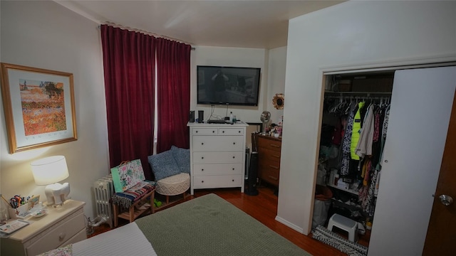 5214 92nd St, Elmhurst, NY 11373 - bedroom featuring dark wood-type flooring, radiator, and a closet