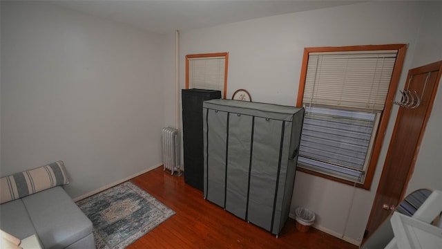 5214 92nd St, Elmhurst, NY 11373 - sitting room featuring radiator heating unit, wood finished floors, and baseboards