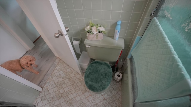 5214 92nd St, Elmhurst, NY 11373 - full bath featuring tile walls, toilet, and a shower with shower door