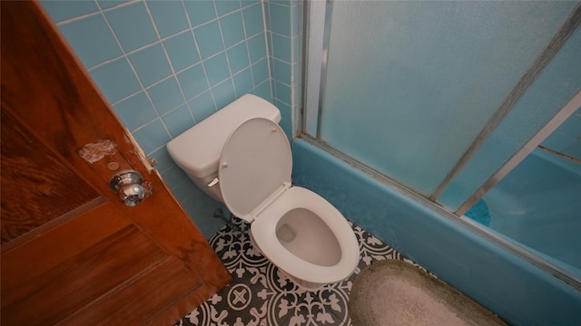 5214 92nd St, Elmhurst, NY 11373 - full bathroom featuring toilet, enclosed tub / shower combo, and tile walls