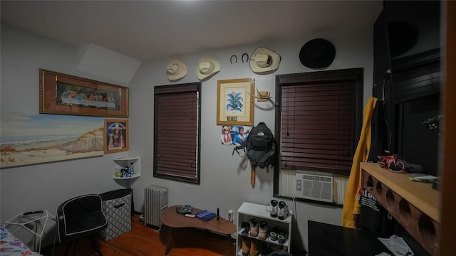 5214 92nd St, Elmhurst, NY 11373 - home office with radiator, wood finished floors, and cooling unit