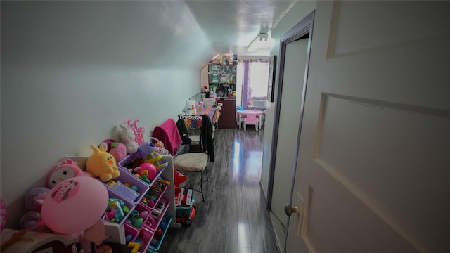 5214 92nd St, Elmhurst, NY 11373 - playroom with lofted ceiling and wood finished floors