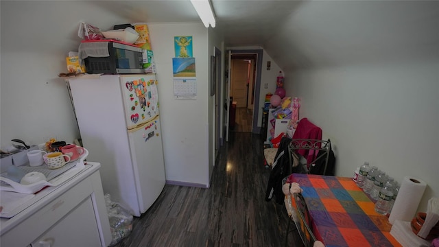 5214 92nd St, Elmhurst, NY 11373 - kitchen featuring wood finished floors, freestanding refrigerator, lofted ceiling, and stainless steel microwave