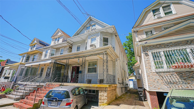 5214 92nd St, Elmhurst, NY 11373 - townhome / multi-family property with a porch