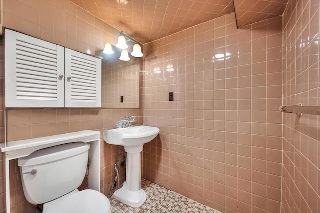 56 Mary St, Valley Stream, NY 11580 - half bathroom featuring toilet and tile walls