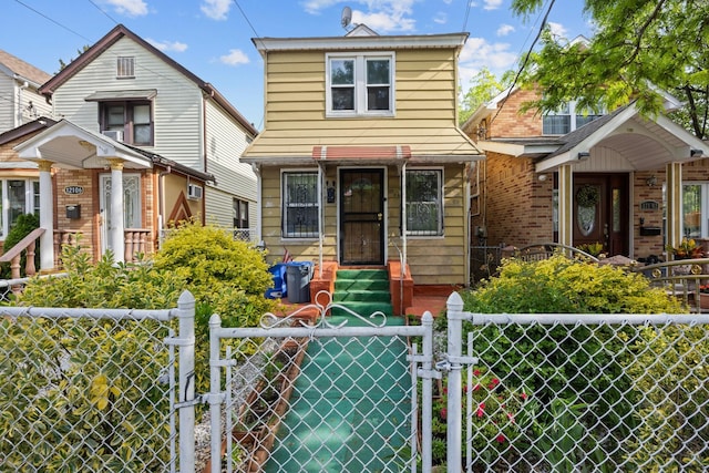 12104 Linden Blvd, South Ozone Park, NY 11420 - view of front of home with a gate and a fenced front yard