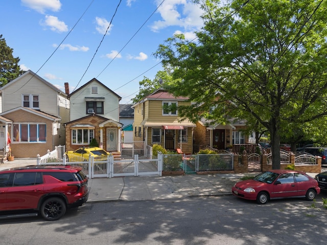 12104 Linden Blvd, South Ozone Park, NY 11420 - view of front of property featuring a gate and a fenced front yard