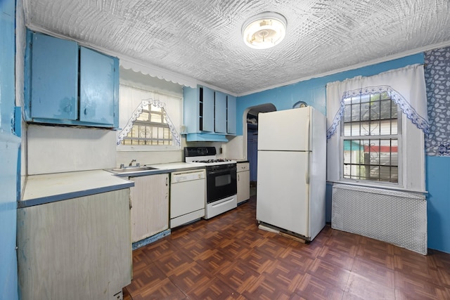 12104 Linden Blvd, South Ozone Park, NY 11420 - kitchen featuring white appliances, blue cabinets, light countertops, a sink, and arched walkways