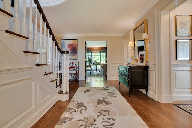 191 Elderfields Rd, Manhasset, NY 11030 - foyer with dark wood finished floors, stairs, crown molding, and a decorative wall