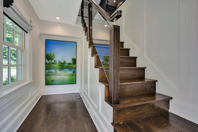 191 Elderfields Rd, Manhasset, NY 11030 - stairs featuring wood finished floors, plenty of natural light, a water view, a decorative wall, and recessed lighting
