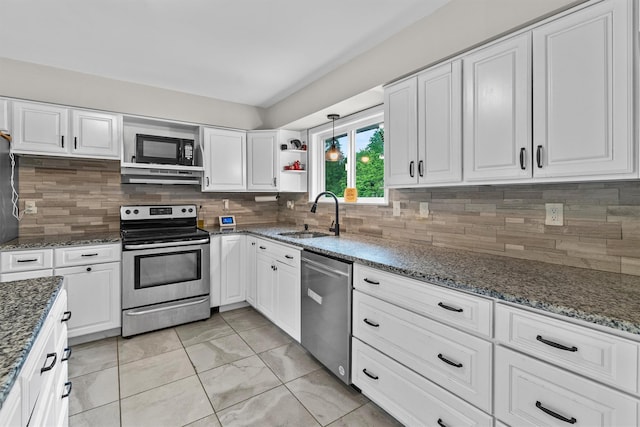 491 Toleman Rd, Rock Tavern, NY 12575 - kitchen featuring stainless steel appliances, a sink, under cabinet range hood, and white cabinetry