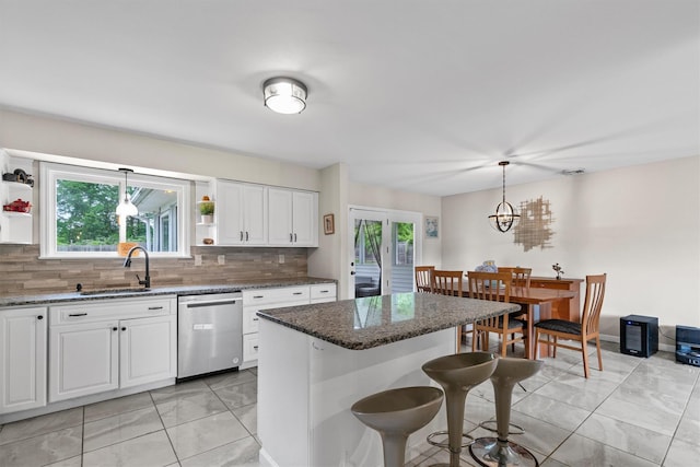 491 Toleman Rd, Rock Tavern, NY 12575 - kitchen featuring dishwasher, light marble finish floors, open shelves, and a sink