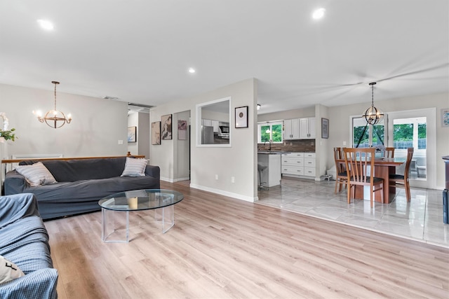 491 Toleman Rd, Rock Tavern, NY 12575 - living area featuring a chandelier, light wood-style flooring, baseboards, and recessed lighting